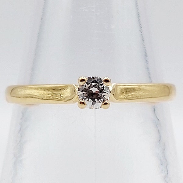 Bague solitaire or 18k ornée d'un diamant taille brillant de 0,15 carats en serti griffes (circa 1970) art deco