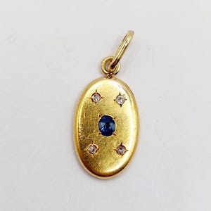 French Art Deco pendant 18k gold set with a sapphire and rose cut diamonds in a star setting (circa 1940)