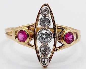 French antique marquise ring 18k gold and platinum set with a line of old mine cut diamonds shouldered with rubies (circa 1920)