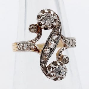 French antique toi et moi ring 18k rose gold set with 0.28 carats of old mine cut diamonds in a scroll setting (circa 1900)