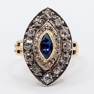 French antique marquise ring 18k rose gold set with a navette cut sapphire surrounded by 0.34 carats of old mine cut diamonds (circa 1900)