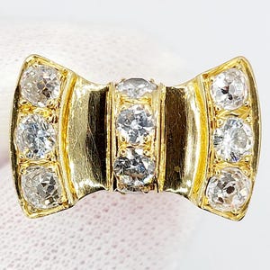 French art deco knot tank ring 18k gold with a 2.46 carat old mine cut diamond brilliant cut diamonds (circa 1950) domed