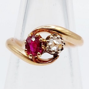 French Antique toi et moi ring 18k rose gold set with a rose cut diamond and a ruby in prong setting (circa 1900)