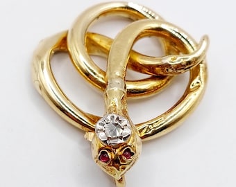 French Antique pendant 18k gold picturing a snake set with a rose cut diamond and small ruby cabochons (circa 1900)
