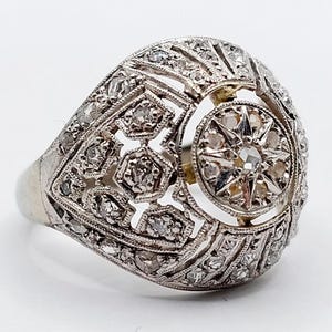 French art deco bombé ring 18k white gold set with rose cut diamonds in star settings in a finely chiseled setting (circa 1920) domed