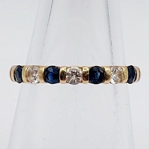 18K gold half-alliance ring adorned with 7 blue spinels and vintage white quartz