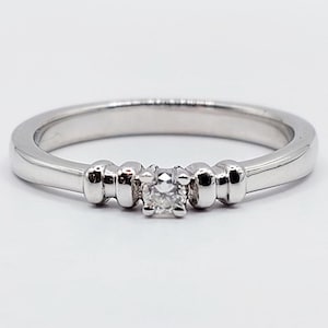 French art deco solitaire ring 18k white gold set with a brilliant cut diamond backed by gadroons decorations circa 1950 Engagement image 1