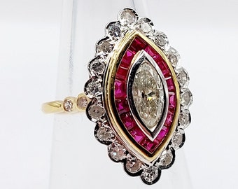 French art deco marquise ring 18k gold set with a 0.50 carat cut diamond, calibrated rubies and 22 brilliant cut diamonds (circa 1960)