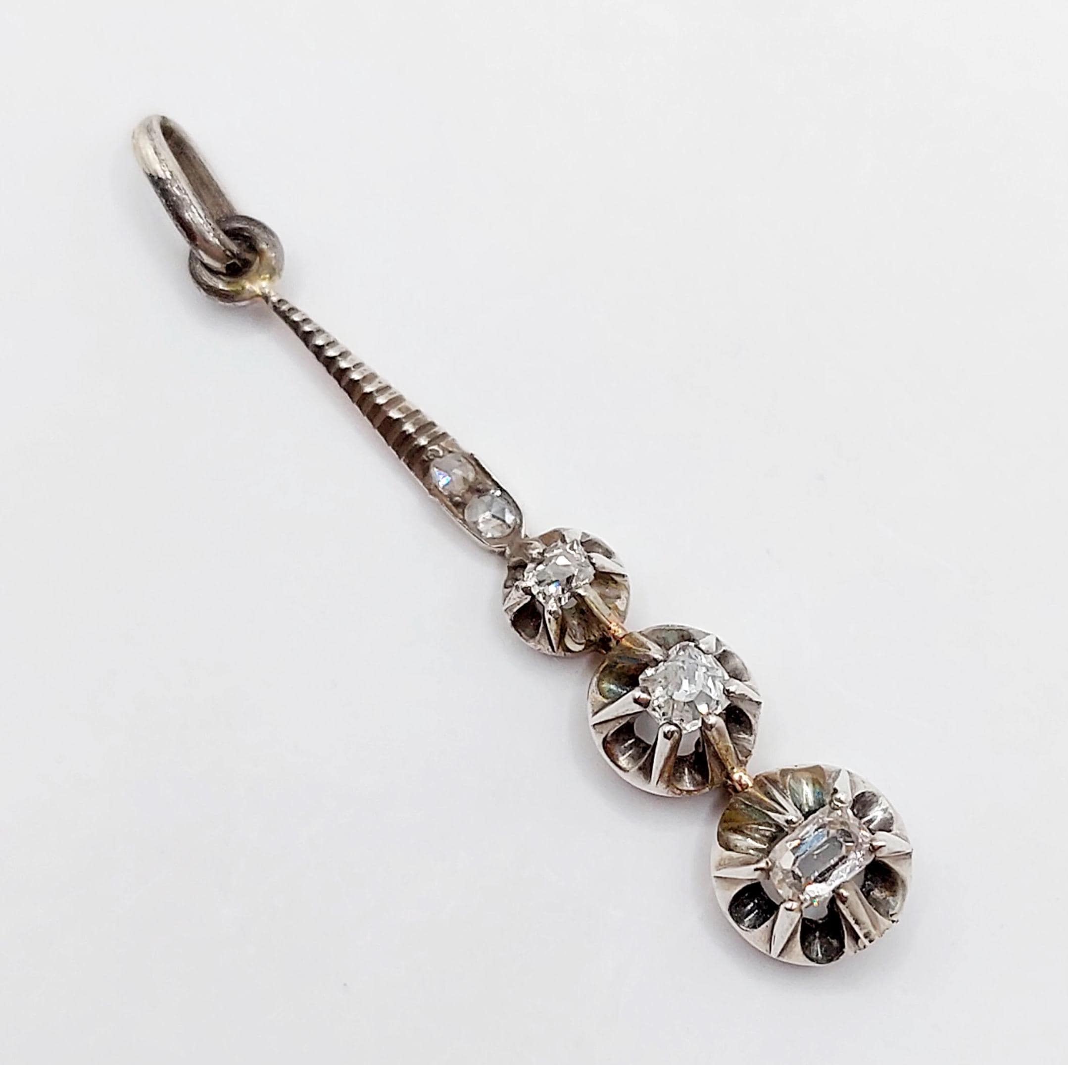 French Victorian pendant Silver forming a drop set with 0.33 carats of old mine cut and rose cut diamonds in prong settings (circa 1850)