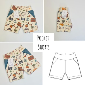 May include: A pair of white and blue patterned shorts with a blue pocket on each side. The shorts have a pirate theme with images of treasure chests, swords, anchors, and pirate hats. The text "POCKET SHORTS" is printed in black on a white background.