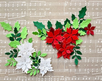 May include: Die-cut paper poinsettia flowers and holly leaves in red, white, and various shades of green. The floral arrangements are layered and textured, featuring intricate petal and leaf edges, displayed against a background of sheet music.