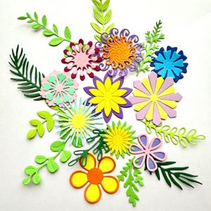 May include: A collection of colourful paper flowers and leaves, including pink, purple, yellow, orange, blue, and green. The flowers are cut out of paper and have intricate designs.