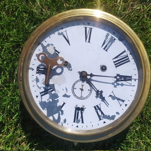 Antique Vintage 1900 New Haven brass ships clock Made in USA in working condition.