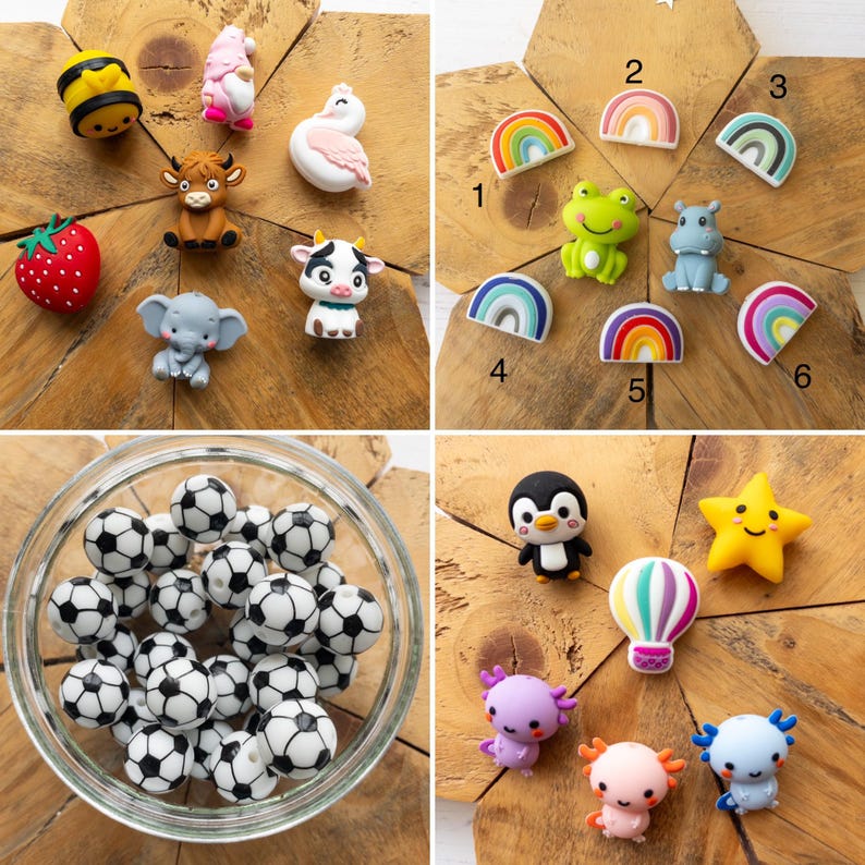 May include: A collection of silicone beads and charms featuring various shapes including a bee, gnome, swan, strawberry, highland cow, elephant, cow, frog, hippo, rainbows, footballs, penguin, star, hot air balloon, and axolotls.