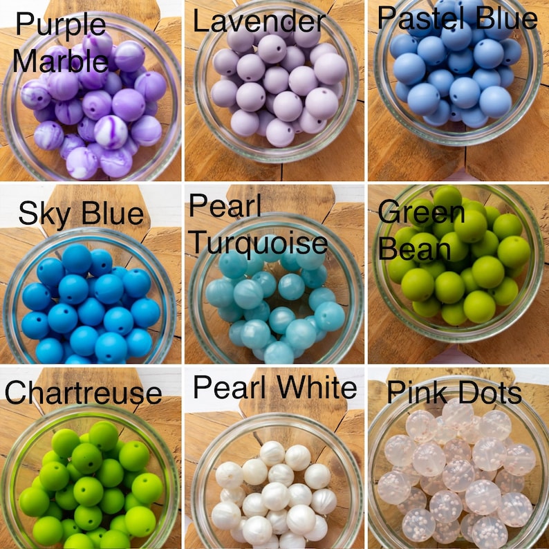 May include: A collection of nine glass bowls filled with various spherical beads labelled Purple Marble, Lavender, Pastel Blue, Sky Blue, Pearl Turquoise, Green Bean, Chartreuse, Pearl White, and Pink Dots, showcasing diverse colours and textures.