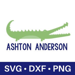 May include: A green alligator with its mouth open, with the text "ASHTON ANDERSON" below it. The text "SVG. DXF. PNG" is in blue at the bottom of the image.