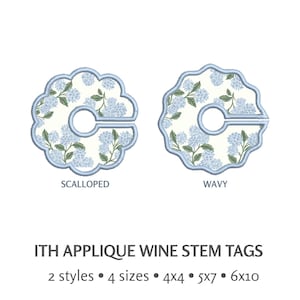 May include: Two wine stem tags with floral designs. One tag has a scalloped edge, the other a wavy edge. Both have a light blue floral pattern on a cream background, with a light blue border. Text at the bottom reads "ITH APPLIQUE WINE STEM TAGS".