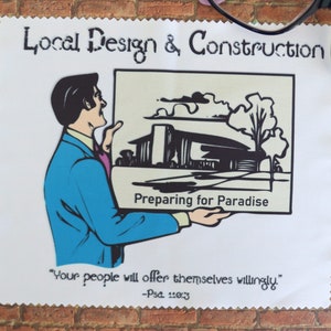 May include: A white cloth with a scalloped edge featuring the text "Local Design & Construction" and "Preparing for Paradise." An illustration depicts a man holding a picture of a building. The text "Your people will offer themselves willingly." is also present.