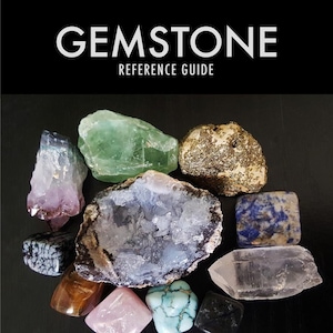 May include: A collection of various gemstones, including amethyst, green fluorite, pyrite, lapis lazuli, agate, clear quartz, tiger's eye, rose quartz, turquoise, and black obsidian. The gemstones are arranged on a black surface. GEMSTONE REFERENCE GUIDE.