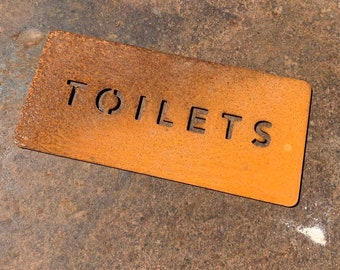 Cor-Ten Steel “Toilets” sign