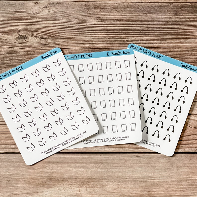 May include: Three sheets of stickers with black and white icons. The first sheet has book icons, the second sheet has e-reader icons, and the third sheet has headphone icons. Each sheet has the text "Always Plans" and a quote from Robert Louis Stevenson: "I kept always two books in my pocket, one to read, one to write in."
