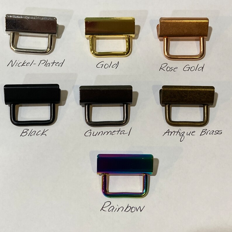 K&ouml;nnte beinhalten: Ein Satz mit 7 Metall-Schiebeschlie&szlig;en in verschiedenen Ausf&uuml;hrungen: vernickelt, gold, ros&eacute;gold, schwarz, gunmetal, antikes Messing und Regenbogen.