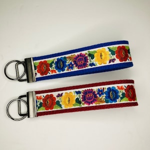 Key Fob Wristlet Keychain Keyring made with Mexican-style flowers on white background