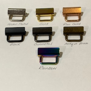 K&ouml;nnte beinhalten: Ein Satz mit 7 Metall-Schiebeschlie&szlig;en in verschiedenen Ausf&uuml;hrungen: vernickelt, gold, ros&eacute;gold, schwarz, gunmetal, antikes Messing und Regenbogen.