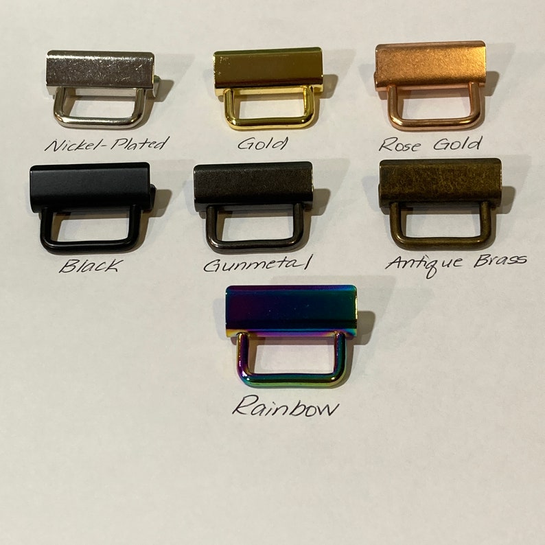 K&ouml;nnte beinhalten: Ein Satz mit 7 Metall-Schiebeschlie&szlig;en in verschiedenen Ausf&uuml;hrungen: vernickelt, gold, ros&eacute;gold, schwarz, gunmetal, antikes Messing und Regenbogen.