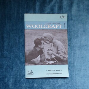 May include: A vintage "Woolcraft" booklet, with a black and white image of a couple knitting and crocheting. The cover is light blue and features the text "Patons & Baldwins" and "A Practical Guide to Knitting and Crochet."