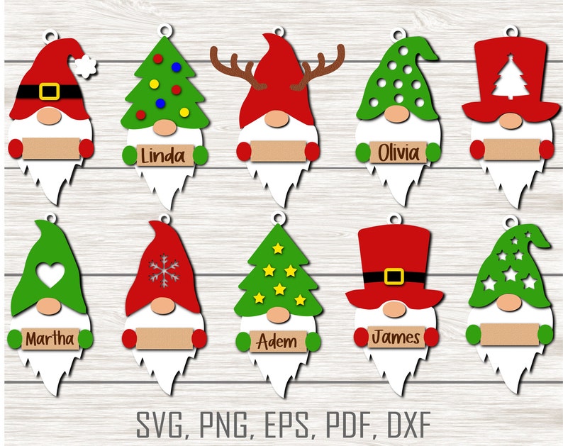 May include: Ten Christmas gnome ornaments with different designs. The gnomes are wearing red, green, and white hats with various decorations. Each gnome has a blank sign for personalization. The gnomes are on a wood background.