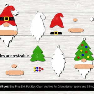 May include: A set of digital cut files for creating Christmas gnome ornaments. The set includes a gnome with a red hat, a white beard, and a green Christmas tree. The files are resizable and can be used with Cricut Design Space and Silhouette.