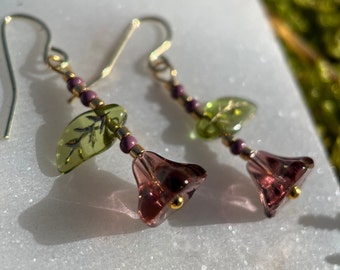 Earrings with colorful glass beads in the shape of flowers