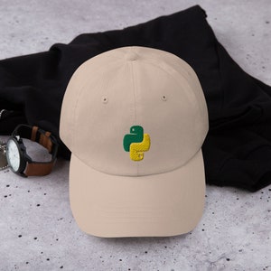 May include: A beige baseball cap with an embroidered green and yellow Python logo.
