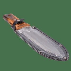 May include: A wood-handled knife with a serrated blade, encased in a clear plastic sheath with a black leather trim. The knife is secured with a black leather strap.