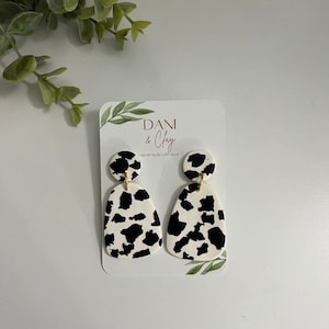 Brincos de argila com estampa de vaca