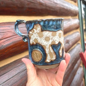Handmade Moose and Pine Trees Badge Mug: White Clay Stenciled over Brown Clay with Polka Dot Details, Denim Blue and Brown Glaze, 16 oz