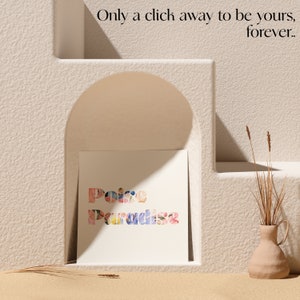 May include: A white card with the words "Peace Paradise" spelled out in colorful floral letters. The card is sitting on a white shelf in a white archway.
