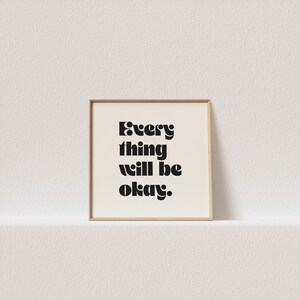 May include: A framed print with a white background and black text that reads "Every thing will be okay."