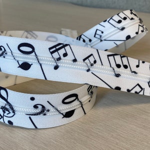 Size 5 custom zipper tape by the yard, music notes, white zipper tape with black music notes