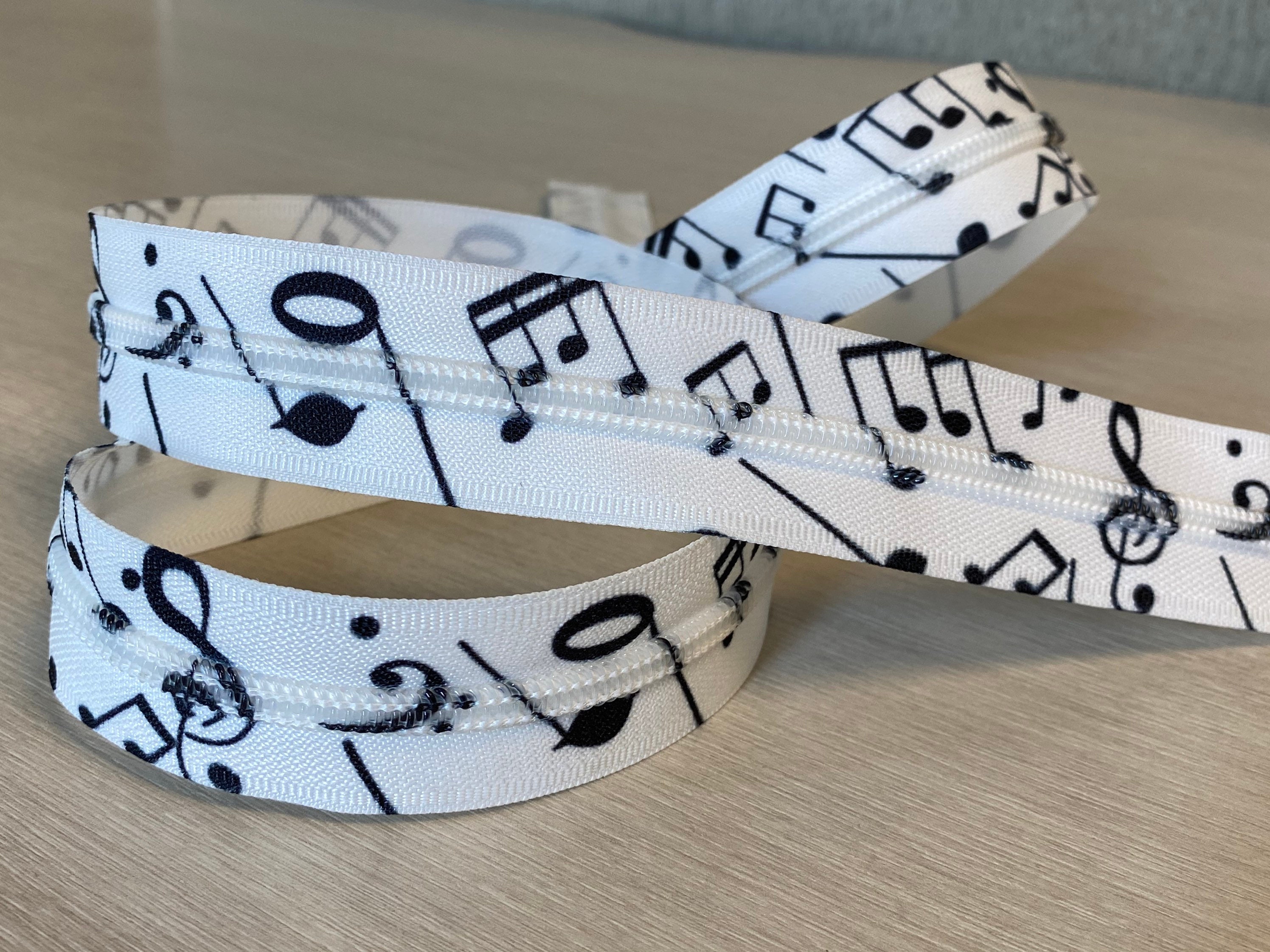 white zipper tape with black music notes Size 5 custom zipper tape by