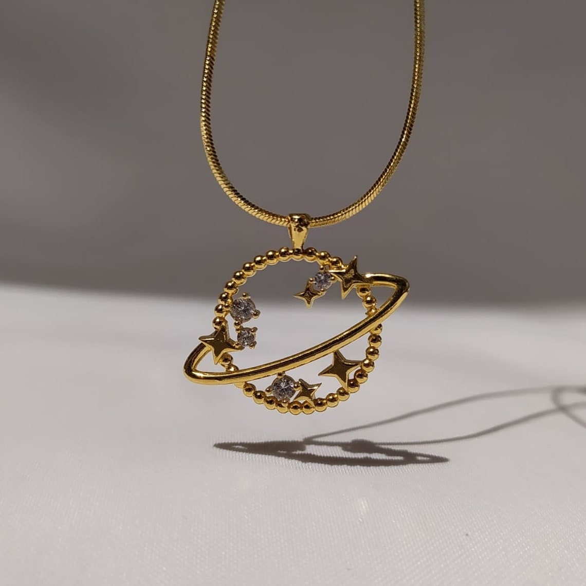 Gold plated Saturn necklace Etsy