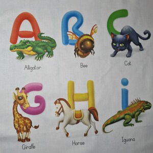 May include: A fabric panel featuring the letters A through I, each paired with an animal illustration. The letters are in bright colors, and the animals include an alligator, bee, cat, giraffe, horse, and iguana. The words for each animal are printed below.