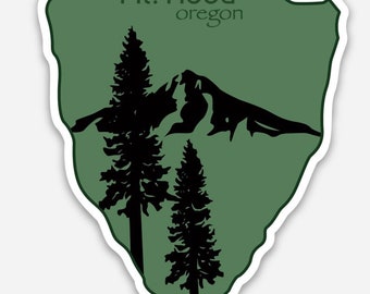 May include: Green sticker with a white outline featuring a silhouette of Mt. Hood, Oregon, with two pine trees in the foreground.