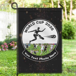 May include: Black garden flag with a soccer theme. The flag features a circular design with the text "WORLD CUP 2026" and a soccer player kicking a ball. The bottom of the flag has the text "You Text Photo Here".