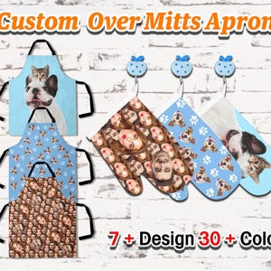 May include: Custom aprons and oven mitts with various designs. The aprons feature images of a cat on a dog, a pattern of dog paws, and a pattern of faces. The oven mitts have a face pattern, a dog paw pattern, and a cat and dog image. The text reads "Custom Over Mitts Apron".