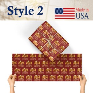May include: Red and gold graduation wrapping paper with the text "Class of 2024" and "Congratulations Natalie" repeated in a pattern.