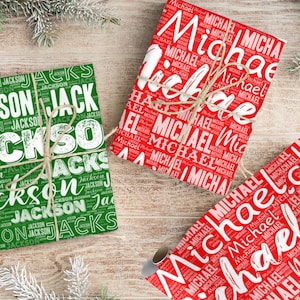 May include: Gift-wrapped presents with the names "Michael" and "Jackson" printed on the wrapping paper. The "Michael" wrapping paper is red with white text, and the "Jackson" paper is green with white text. The gifts are tied with twine.