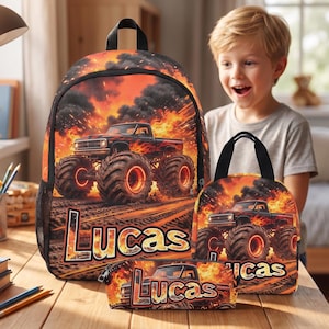 May include: A backpack, lunch bag, and pencil case set featuring a black monster truck graphic surrounded by orange flames and black smoke. Each item displays the name Lucas in bold, stylized lettering across the front of the fiery design.