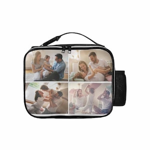 May include: Black lunch bag with a zipper closure and a side pocket. The bag is decorated with a collage of four photos of a family playing together.